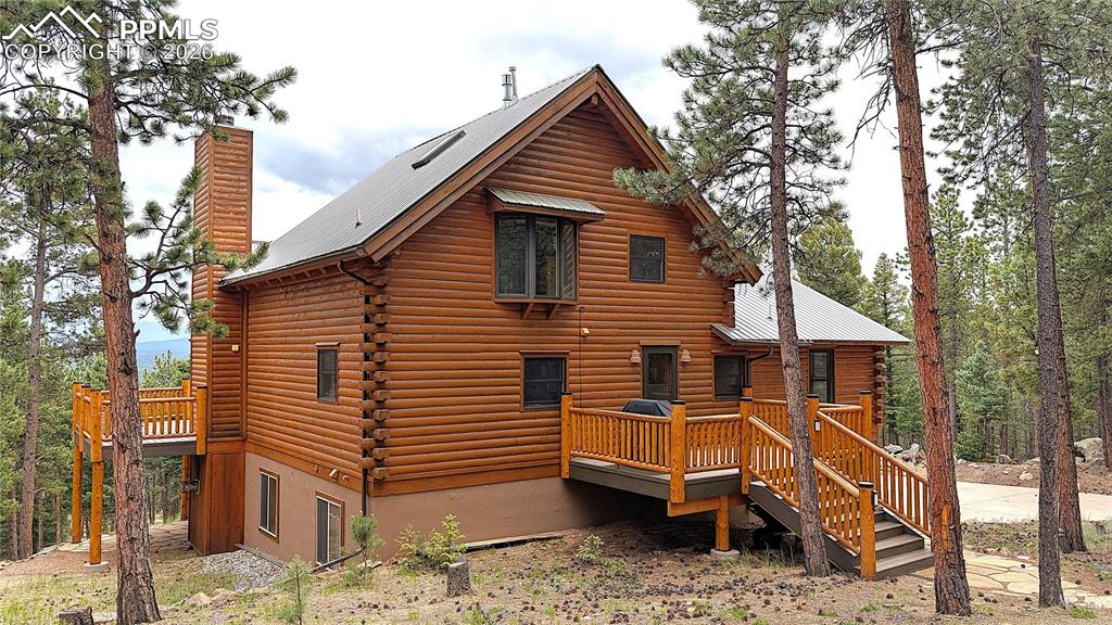 Image 5 of 43: The back deck enters near the kitchen and also features the low-maintenance
