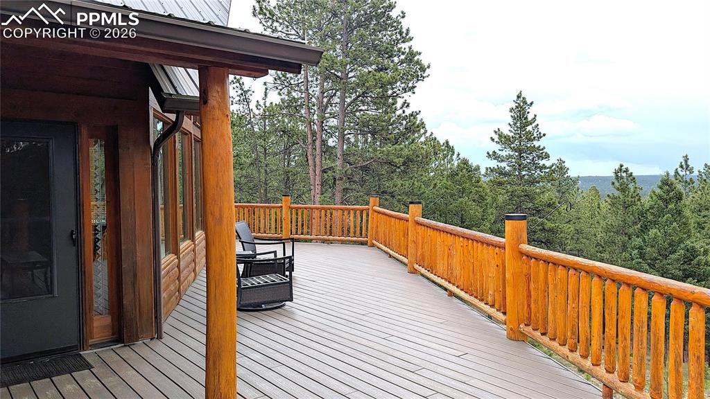 Image 7 of 43: This 64-foot long, wrap-around deck with barefoot-ready composite decking &