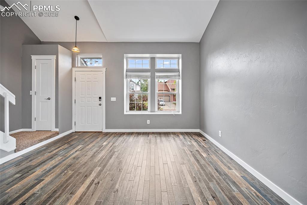 Image 7 of 50: front door enters into a large living room