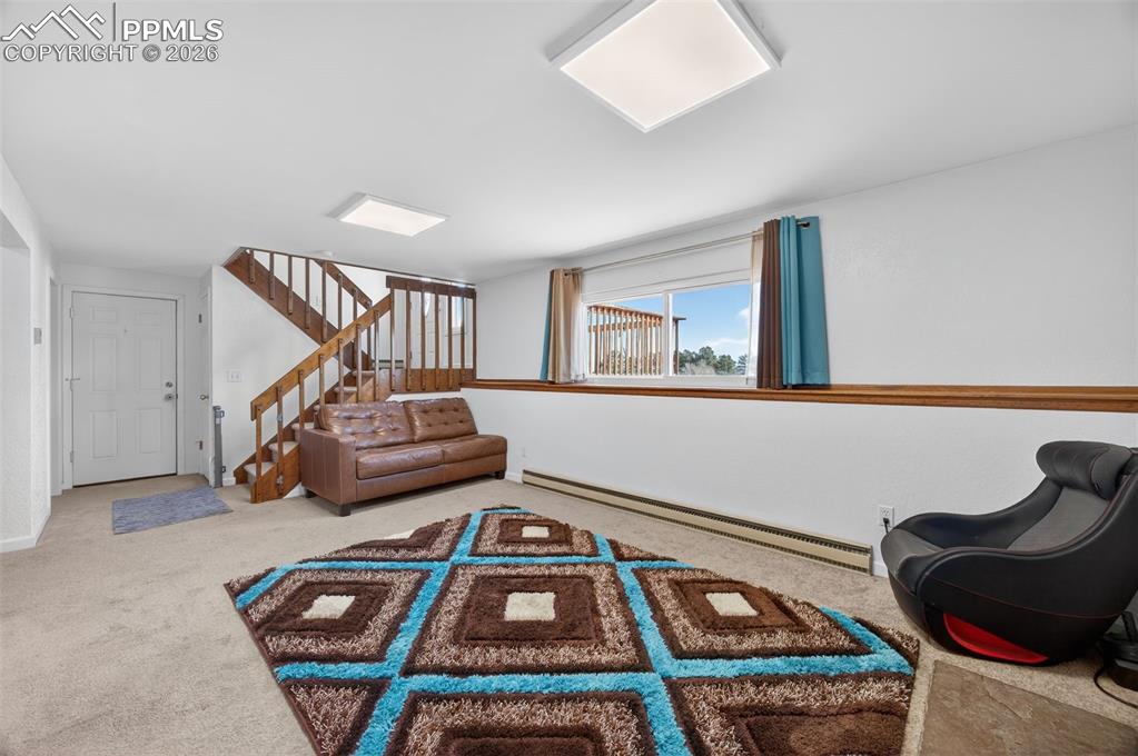 Image 18 of 34: Lower Family Room with Garage Access