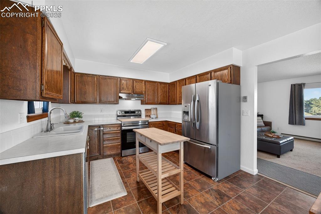 Image 9 of 34: Newer Range/Hood, and Dishwasher
