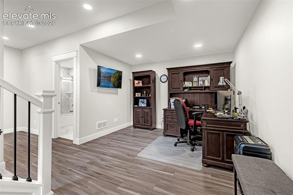 Image 12 of 33: Finished basement, living area, full bathroom and 1 bedroom.