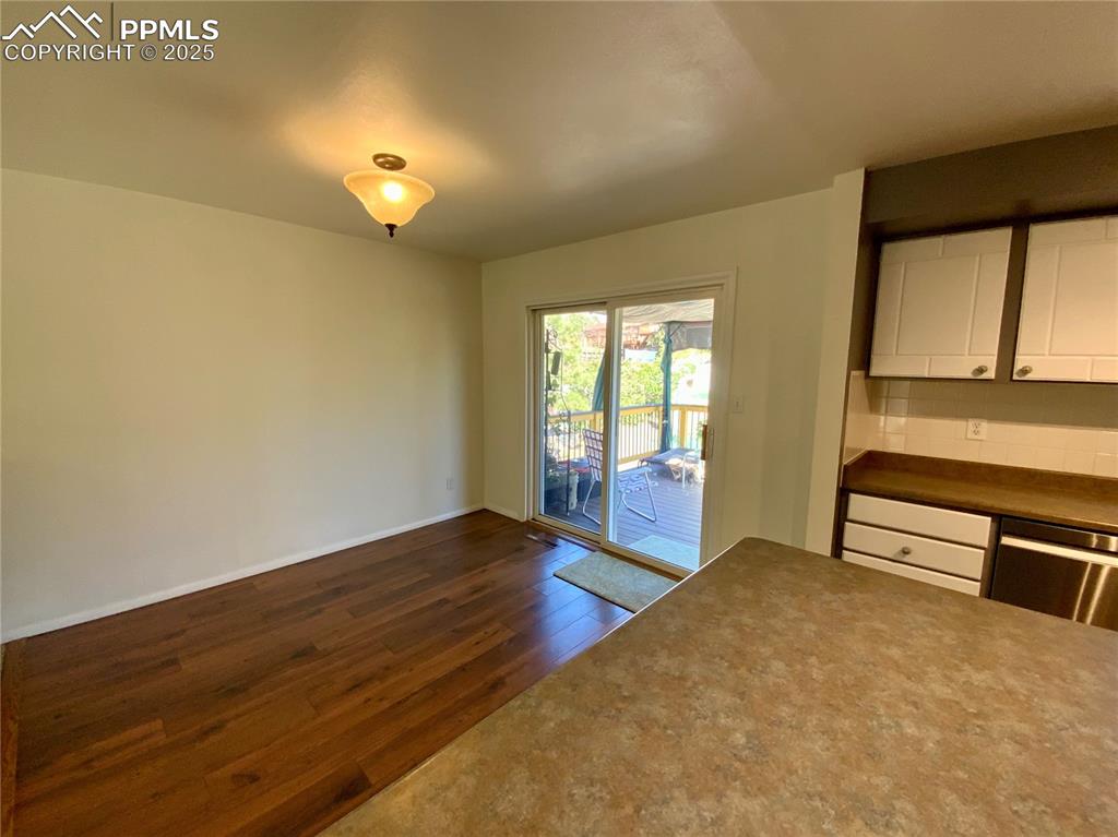 Image 10 of 22: Dining Area with Wood Laminate Floors