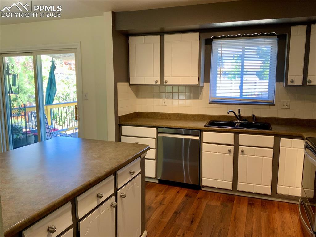 Image 8 of 22: View of Kitchen with Solid Countertops & Stainless Steel Appliances