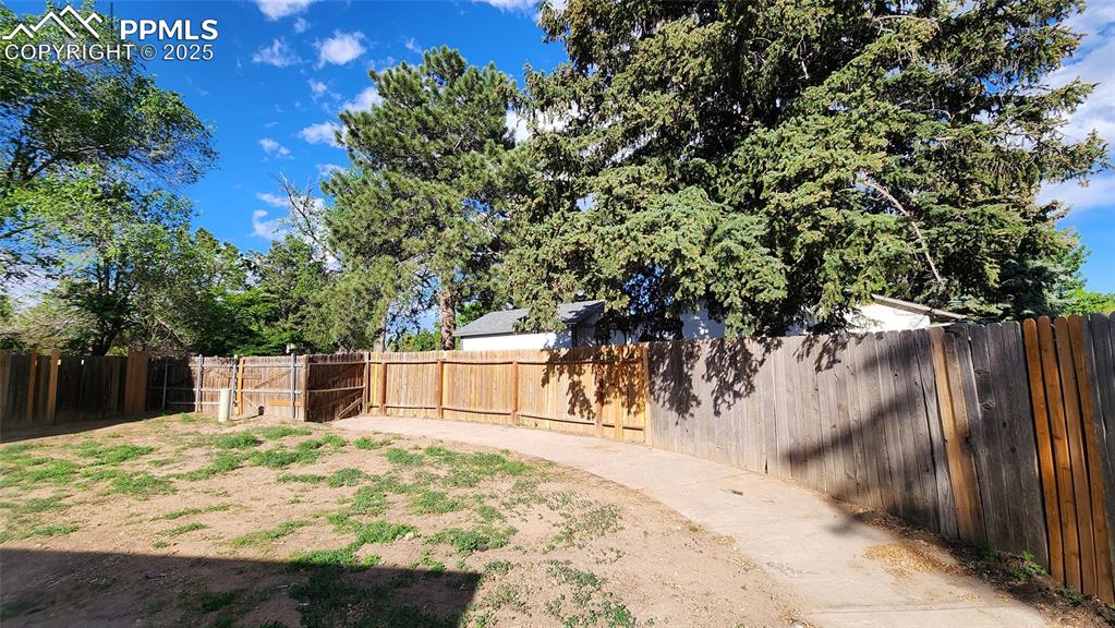 Image 15 of 15: View of fenced backyard