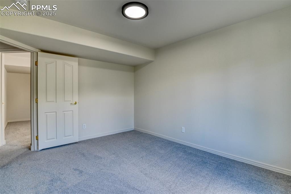 Image 37 of 46: Unfurnished bedroom featuring light carpet and baseboards