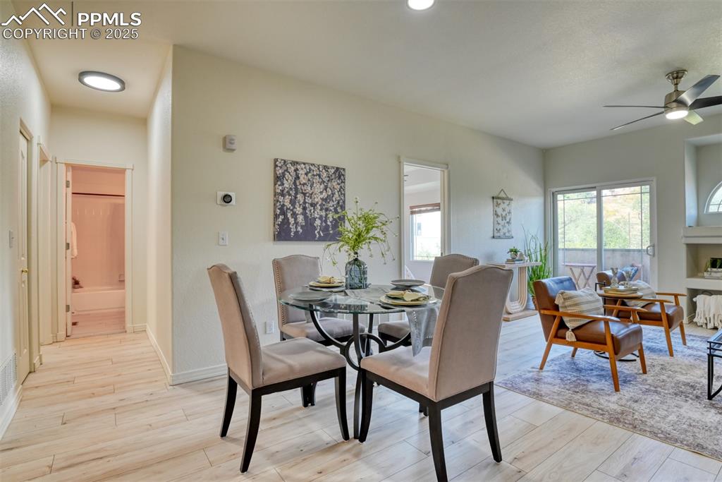 Image 8 of 46: Dining room featuring light wood-type flooring, ceiling fan, and recessed l