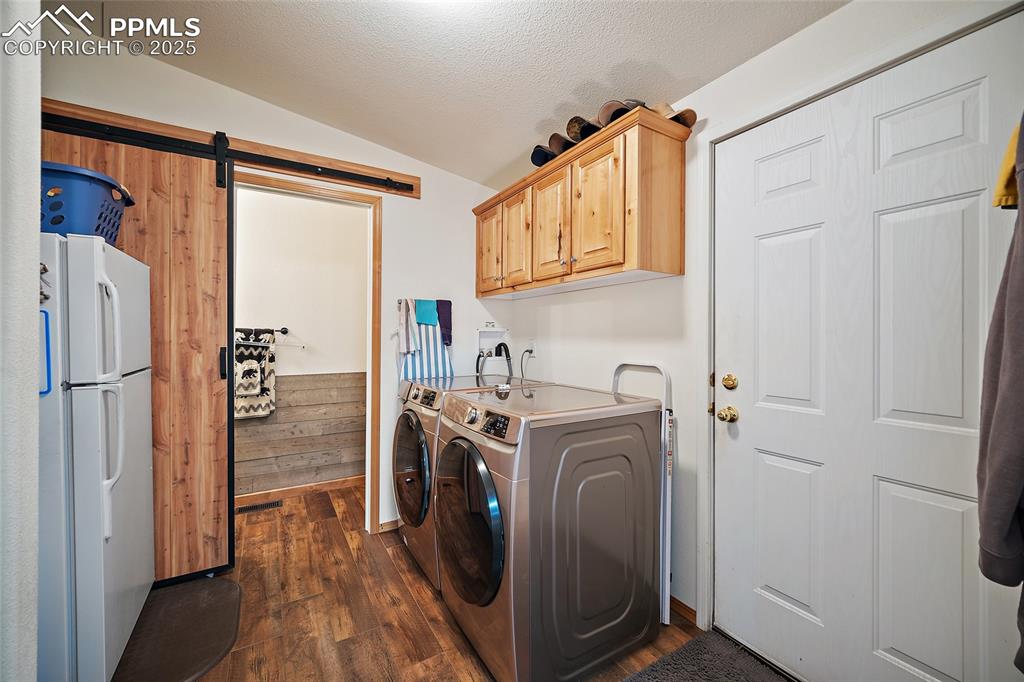 Image 17 of 33: Laundry/Mud Room with access to Garage