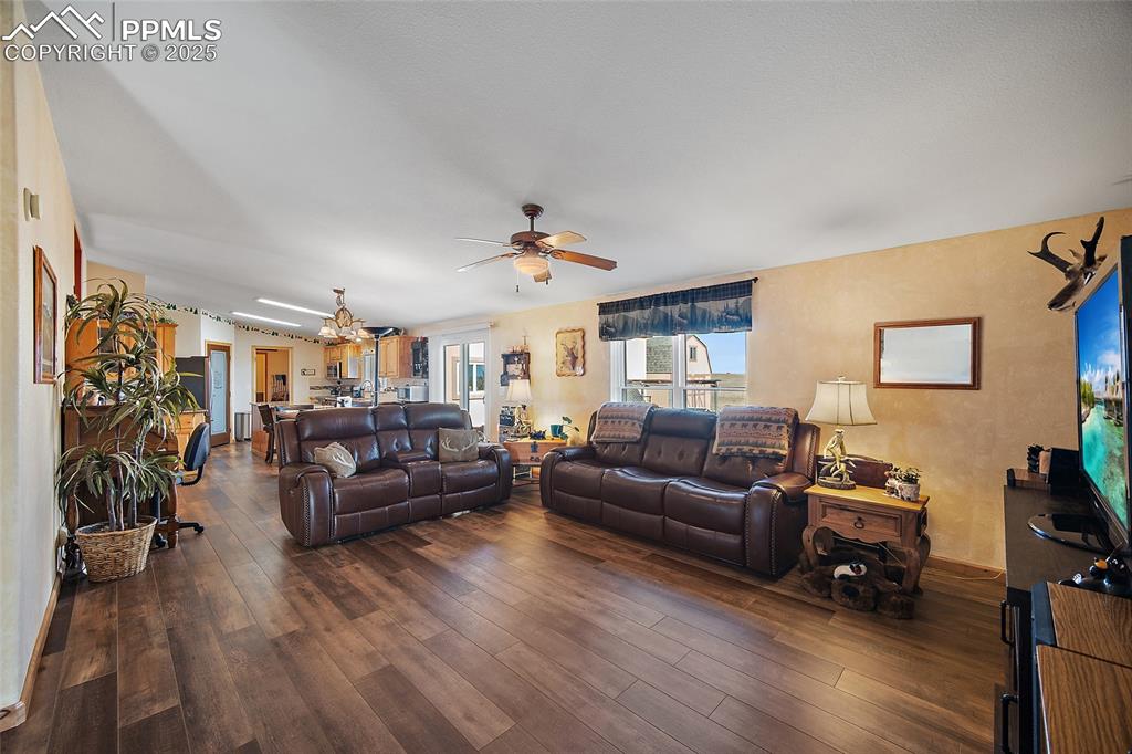 Image 4 of 33: Great Room opens to Kitchen & Dining Area