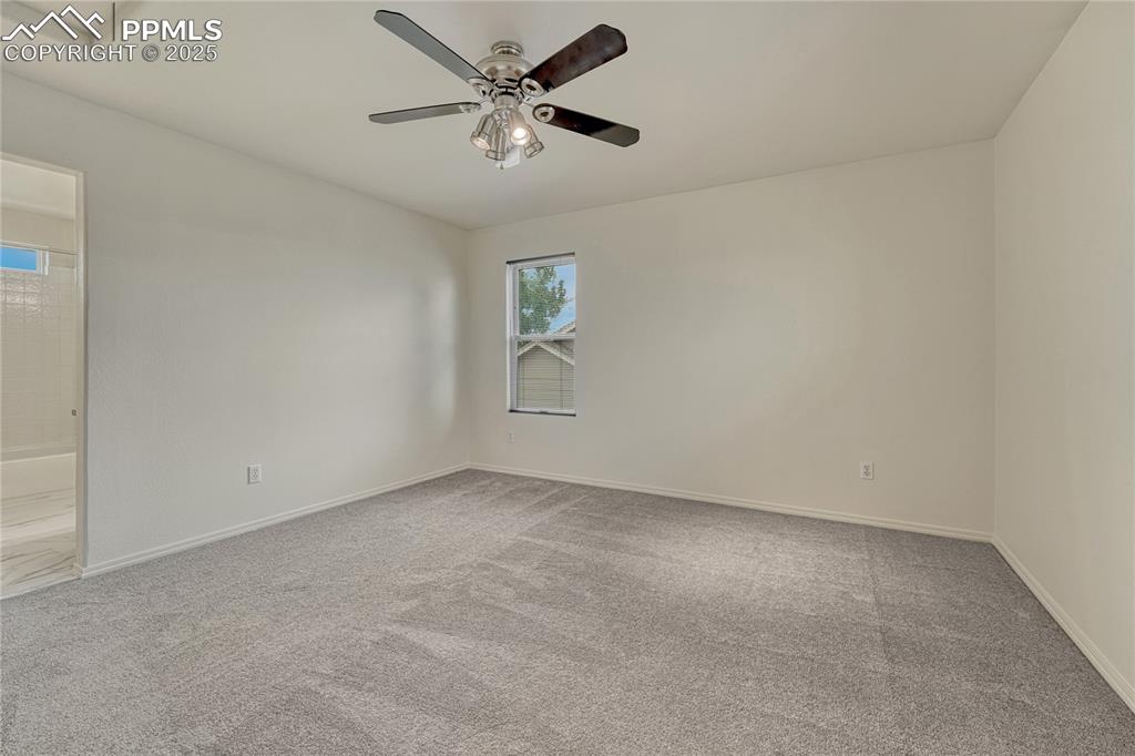 Image 19 of 50: PRIMARY BEDROOM WITH BATH