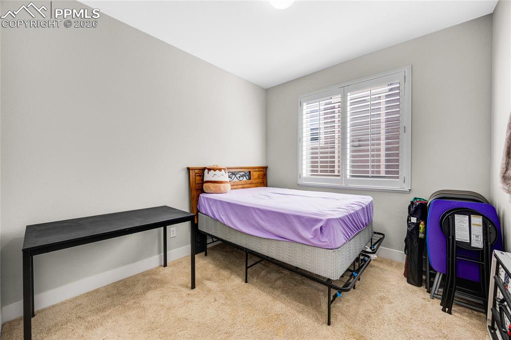 Image 26 of 37: Bedroom featuring light carpet