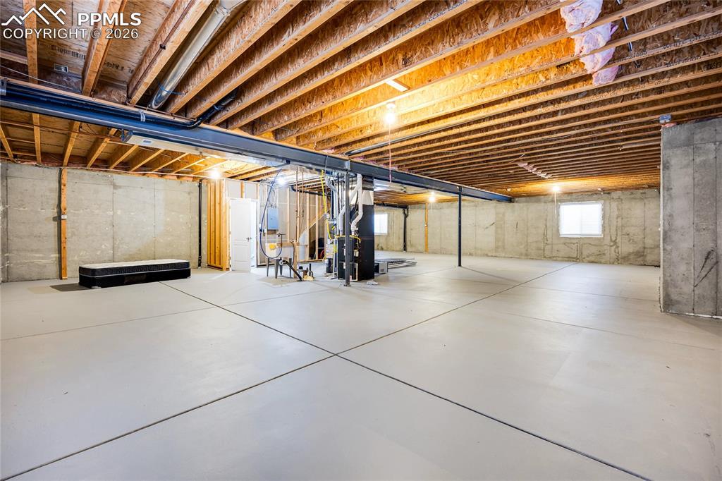 Image 30 of 37: Below grade area with heating unit