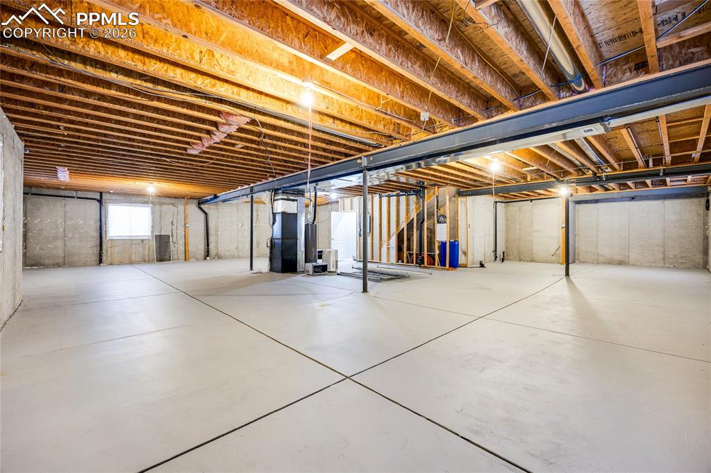 Image 31 of 37: Below grade area featuring heating unit