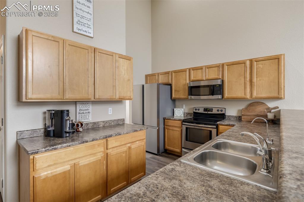 Image 10 of 35: With ease of access to the panty and dining room, this kitchen is waiting f