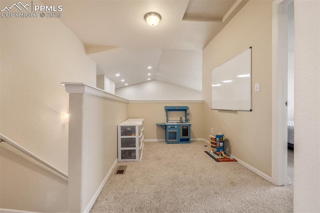 Image 16 of 35: The upper loft makes for a great toy space or quiet reading nook