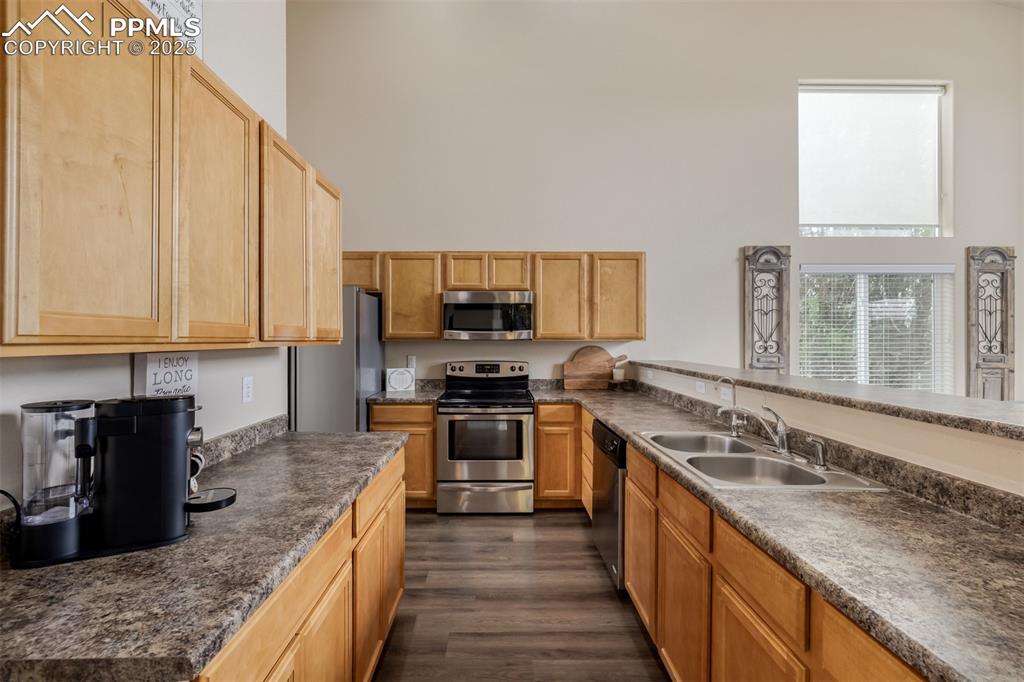 Image 9 of 35: This spacious kitchen offers ample cabinet space, countertops and a full he