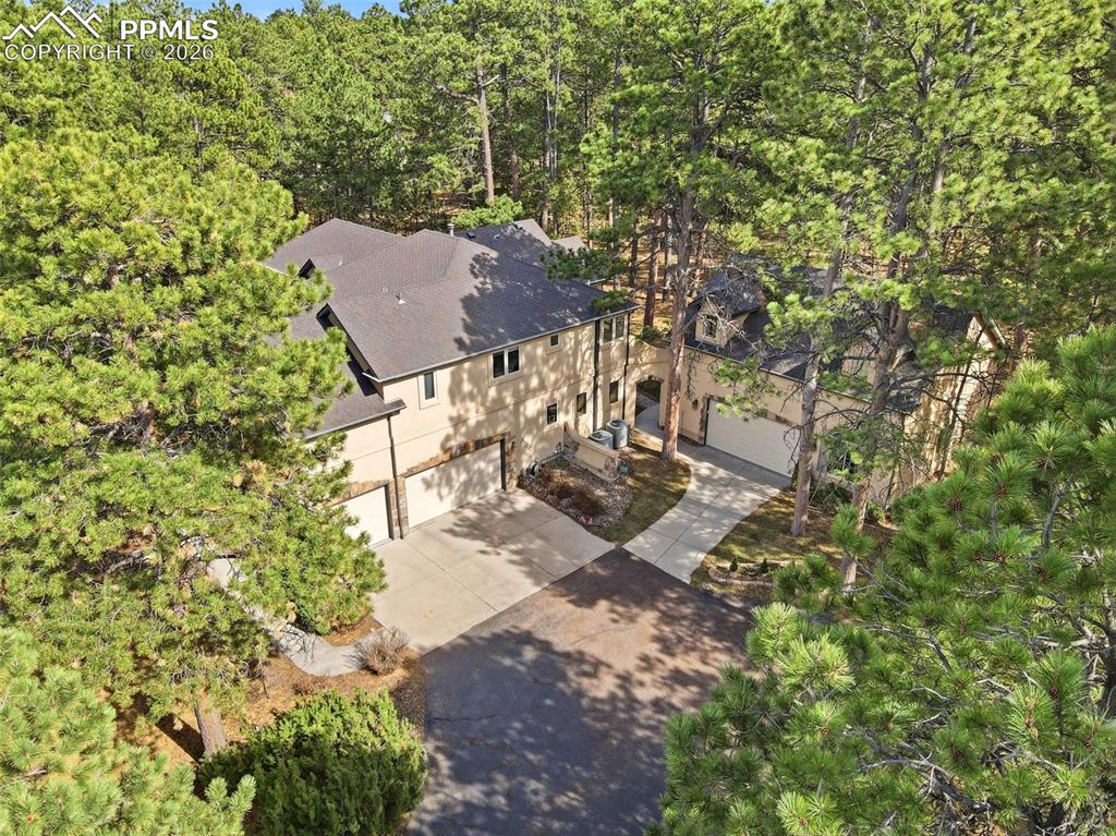 Image 2 of 50: Aerial of side of home that leads to courtyard