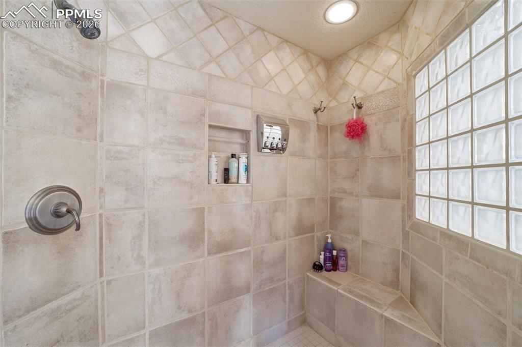 Image 46 of 50: Primary Bathroom featuring walk in tiled shower