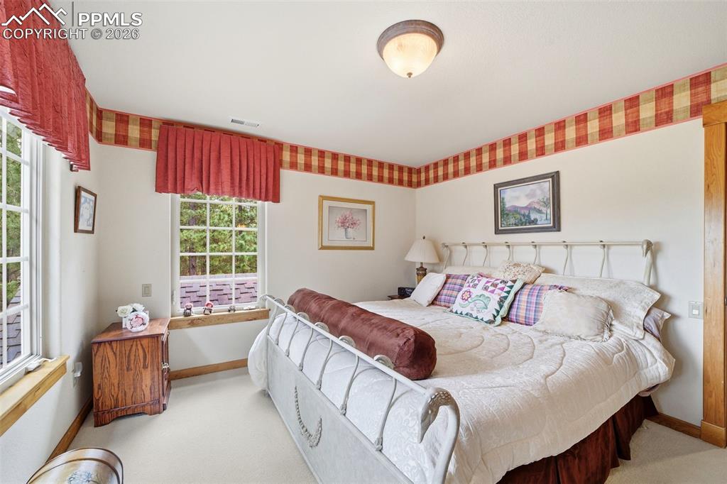 Image 47 of 50: Bedroom featuring ensuite bathroom