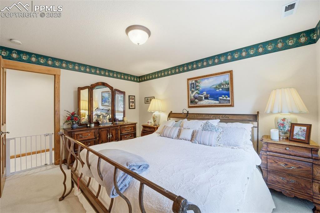 Image 48 of 50: Bedroom Upper Level with Ensuite Bathroom