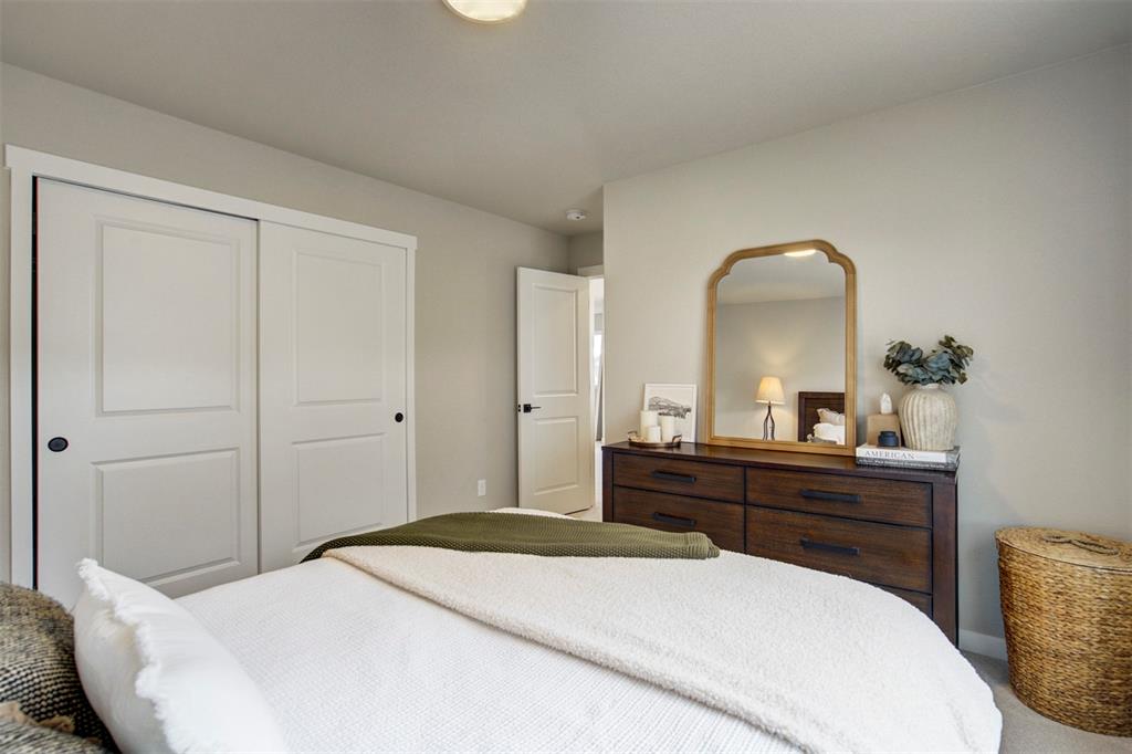 Image 26 of 43: Carpeted bedroom featuring a closet