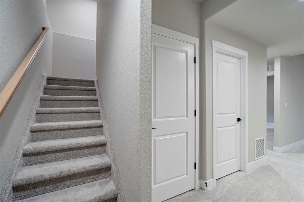 Image 32 of 43: Stairs featuring carpet and baseboards