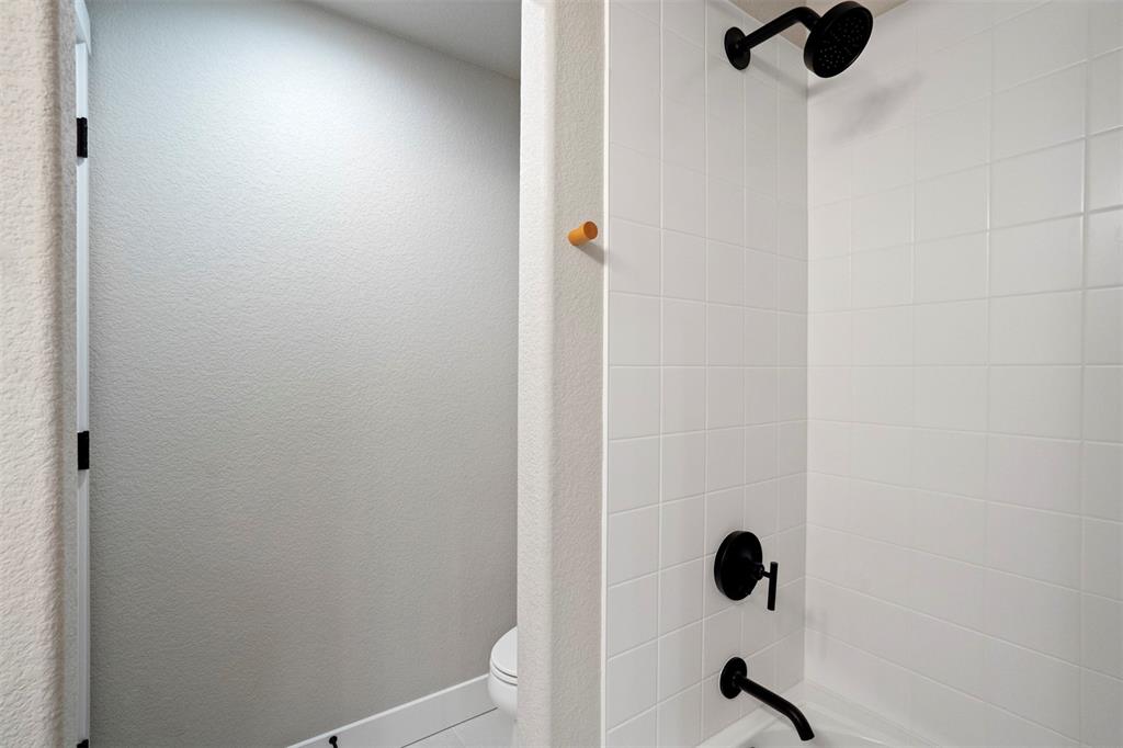 Image 37 of 43: Full bathroom with shower / bathtub combination and toilet