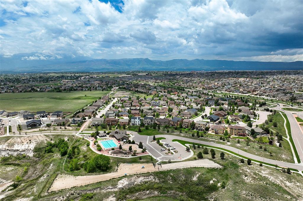 Image 43 of 43: Aerial view of property and surrounding area featuring nearby suburban area