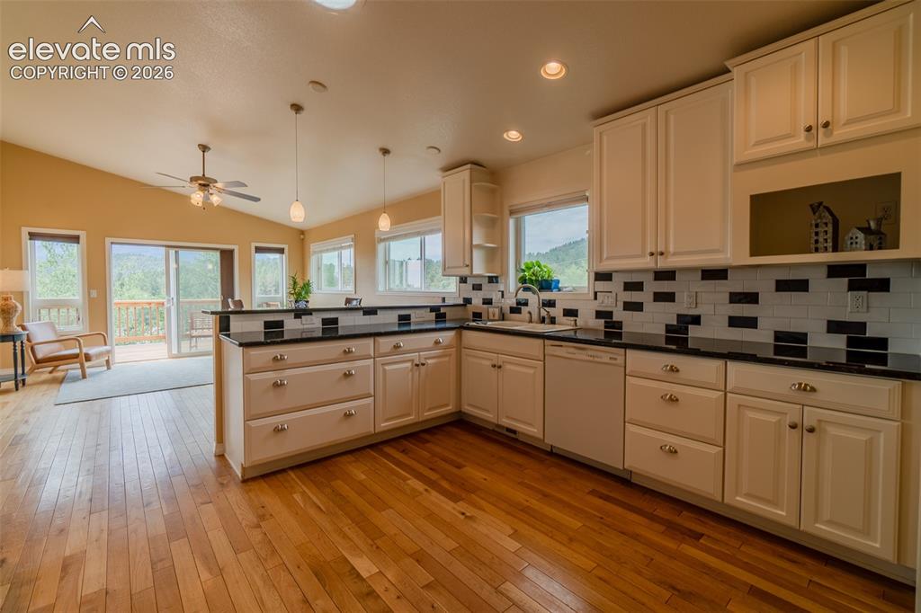 Image 12 of 41: Thoughtfully designed kitchen featuring abundant cabinetry, generous counte