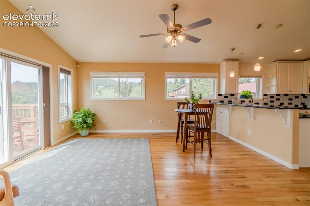 Image 15 of 41: Bright, open family room with easy access to the kitchen and breakfast bar 