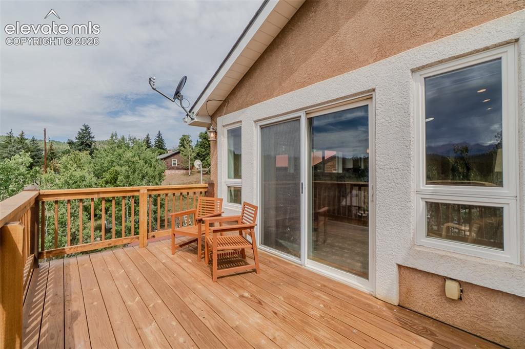 Image 18 of 41: Step outside to the spacious deck and take in the breathtaking mountain vie