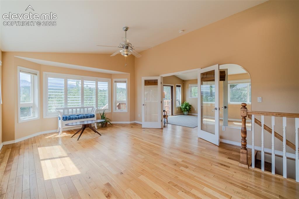 Image 20 of 41: Spacious primary suite filled with natural light and large windows showcasi