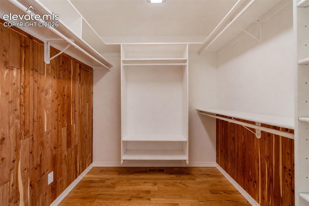 Image 24 of 41: The primary suite includes a cedar-lined walk-in closet with thoughtfully d