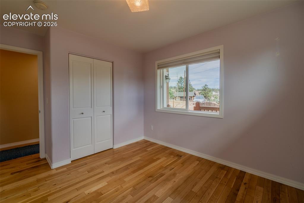 Image 5 of 41: Versatile front bedroom with an attached bath—perfect for guests, a home of