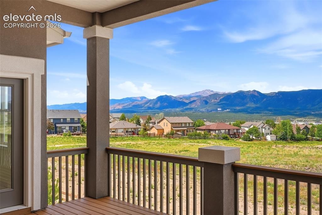 Image 11 of 50: Spacious Covered Rear Deck with Western exposure for to enjoy those Colorad