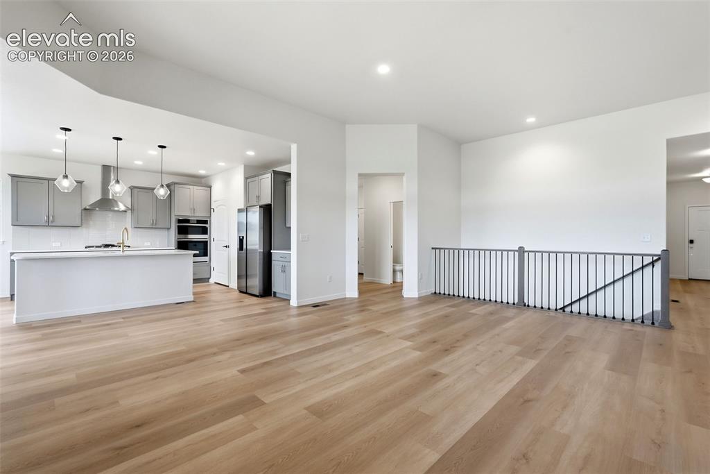 Image 13 of 50: Great Room and Kitchen