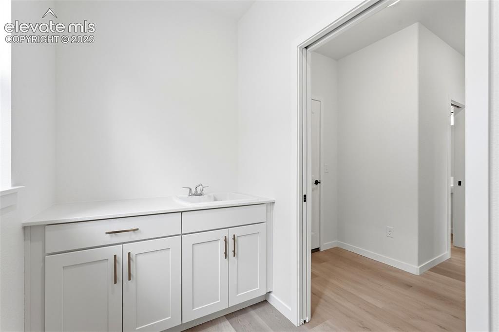 Image 26 of 50: Base Cabinet with Sink in the Laundry Room!