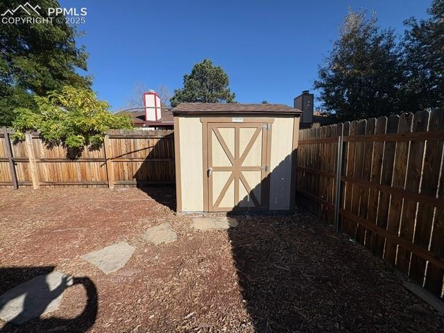Image 14 of 28: View of shed featuring a fenced backyard