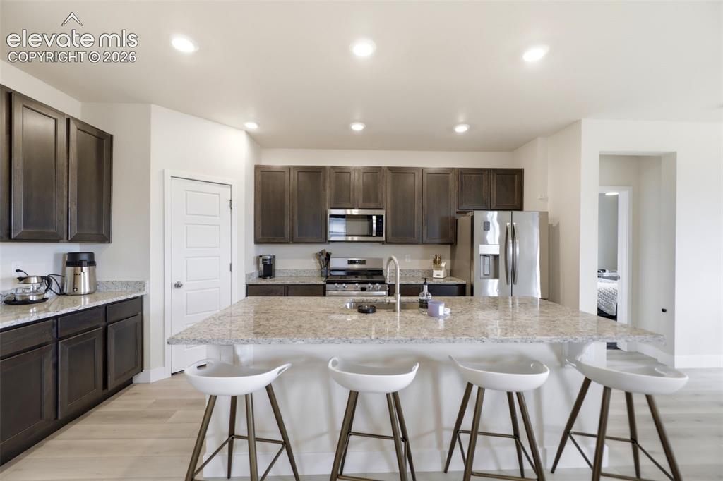 Image 11 of 49: The open floor plan includes a beautiful dining area next to the kitchen an