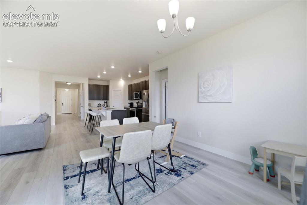 Image 12 of 49: Enjoy the natural light in the dining area, with direct access to the backy