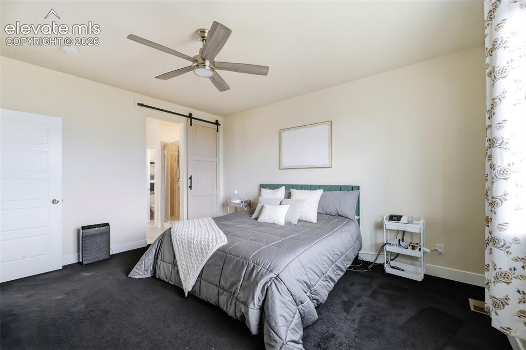 Image 14 of 49: Abundant natural light fills the primary bedroom.