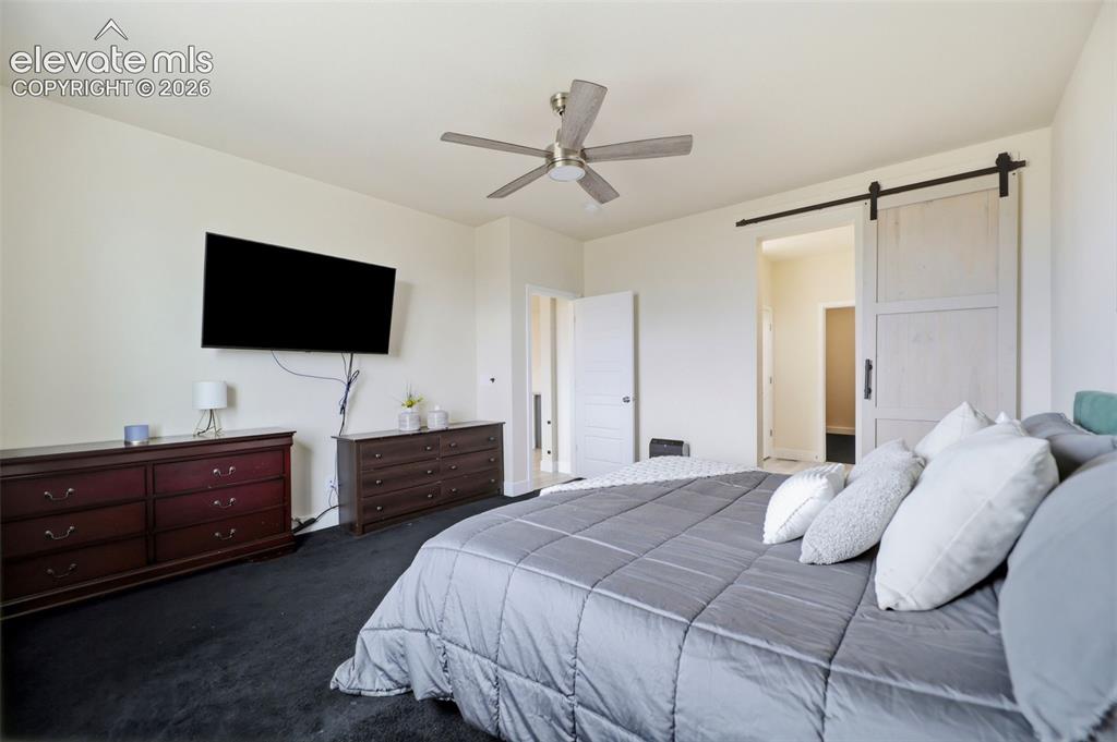 Image 15 of 49: Beautiful granite countertops, hardwood flooring, and a double vanity accen