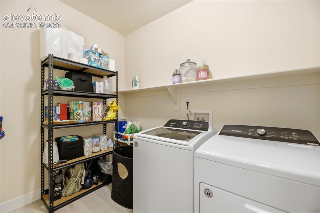 Image 21 of 49: A third bedroom on the main level also works as an office space. 