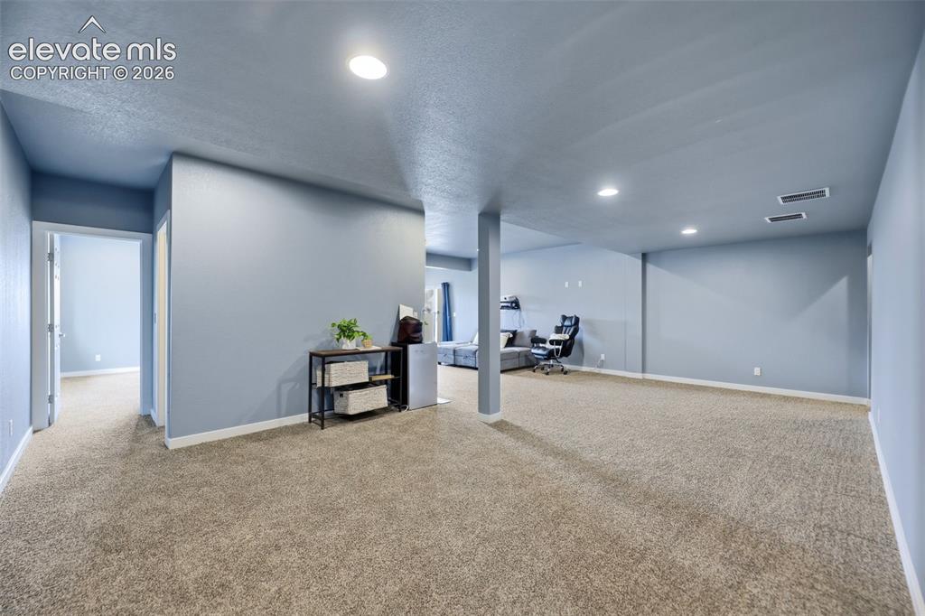 Image 26 of 49: The family room also provides walk-out access to the backyard and patio.