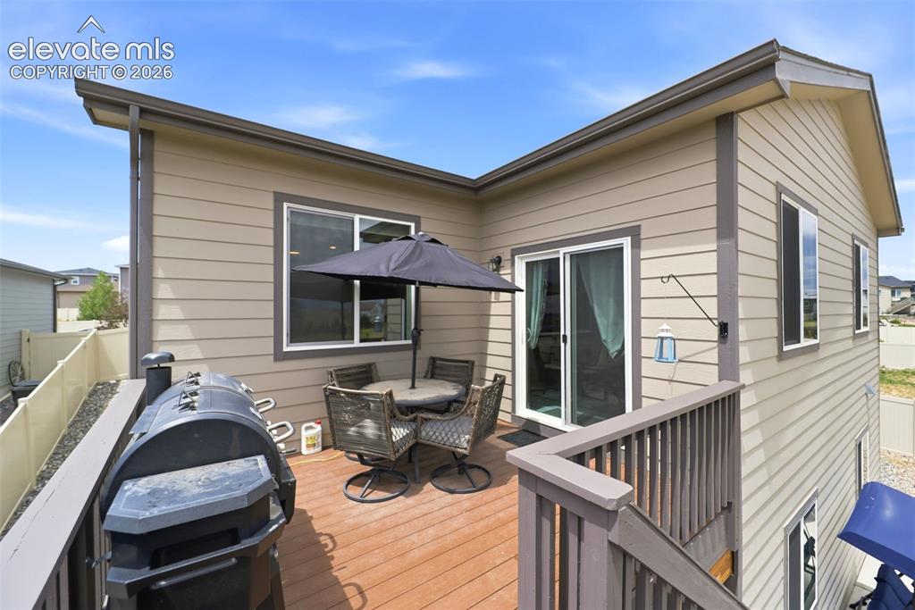 Image 36 of 49: Back yard and patio