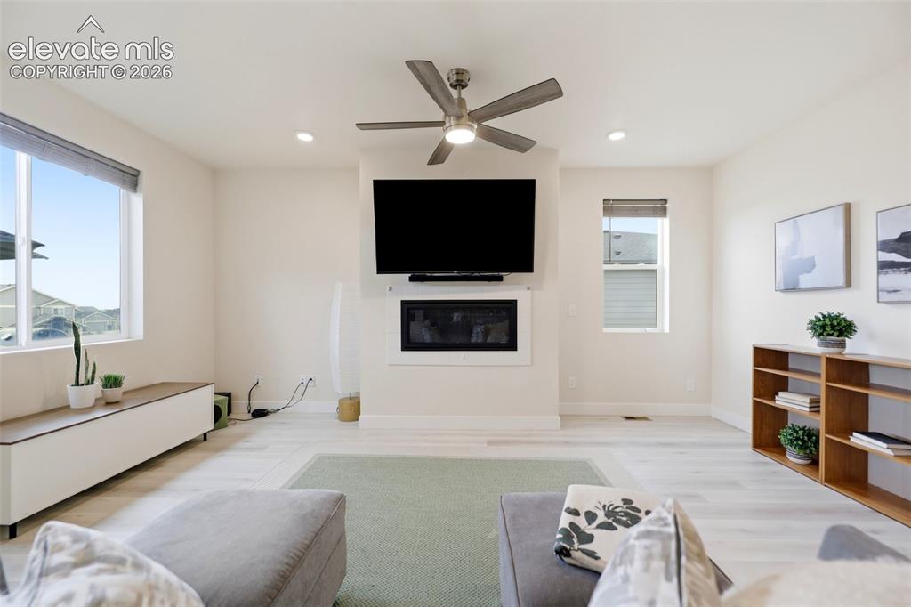 Image 5 of 49: The living room is right off the kitchen and perfect for entertaining famil