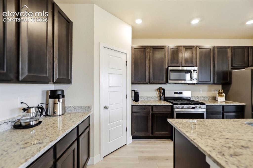 Image 9 of 49: Enjoy cooking on the gas stovetop and having plenty of countertop space!