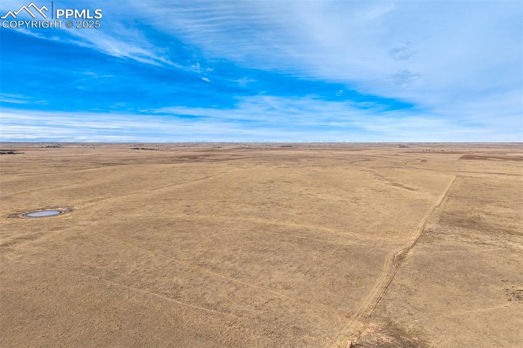 Image 10 of 30: Aerial view of sparsely populated area featuring a desert landscape