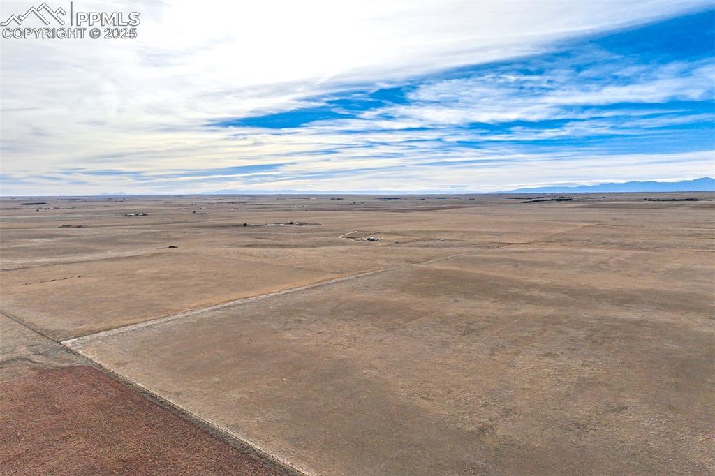 Image 12 of 30: Aerial view of sparsely populated area with a desert landscape