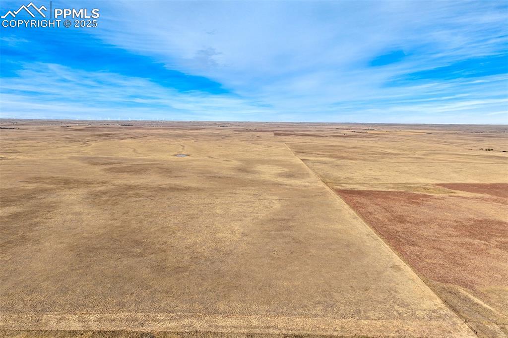 Image 15 of 30: Aerial view of sparsely populated area with a desert landscape